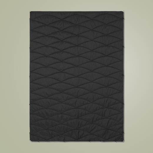 Black quilted puffer blanket laid flat